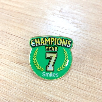 Huy hiệu cài áo Champions -